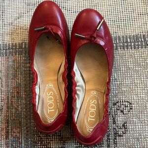 Tod’s Red Ballet Flats in excellent condition.
